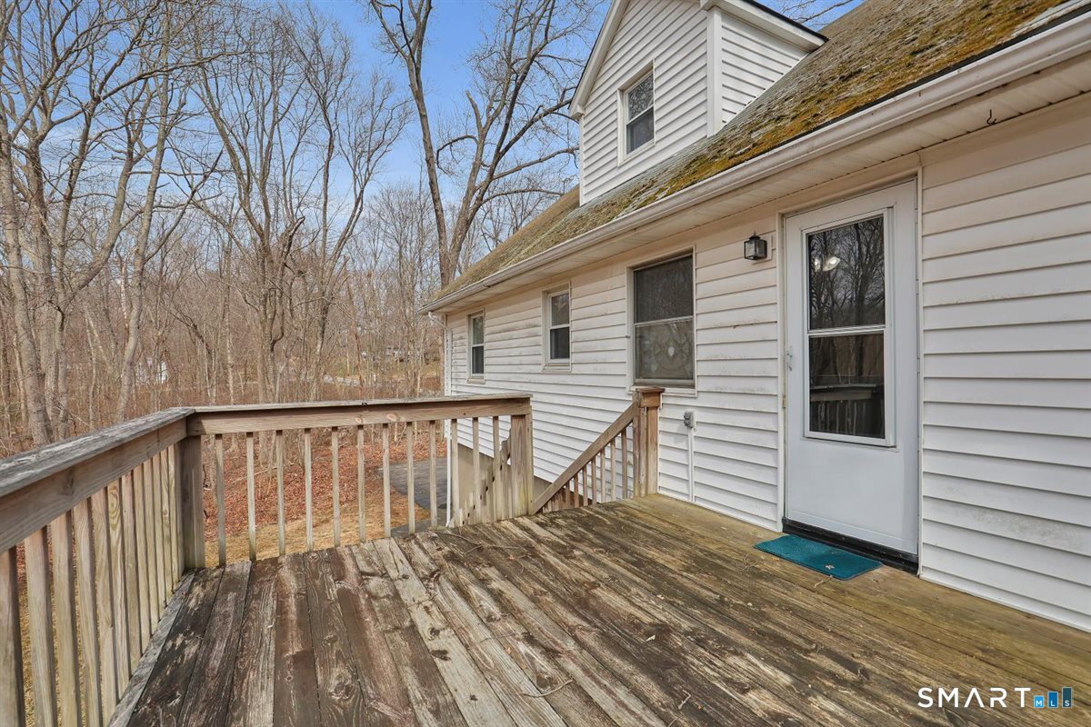 47 Park Road Colchester, CT 06415 - Photo 25 of 31 Start your day with coffee on the back deck! This versatile outdoor space is a great retreat for grilling and quiet relaxation.