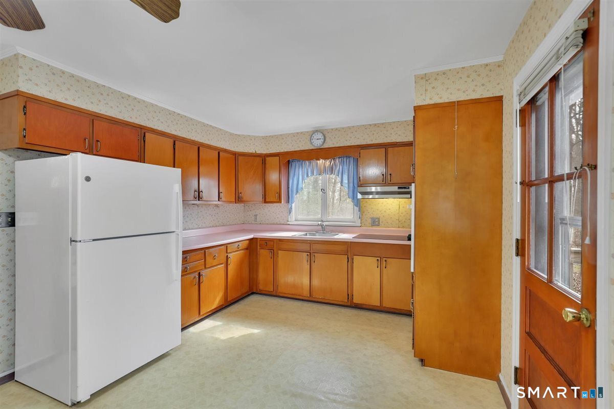 47 Park Road Colchester, CT 06415 - Photo 7 of 31 Back door with easy access to the deck perfect for grilling and enjoying the outdoors.