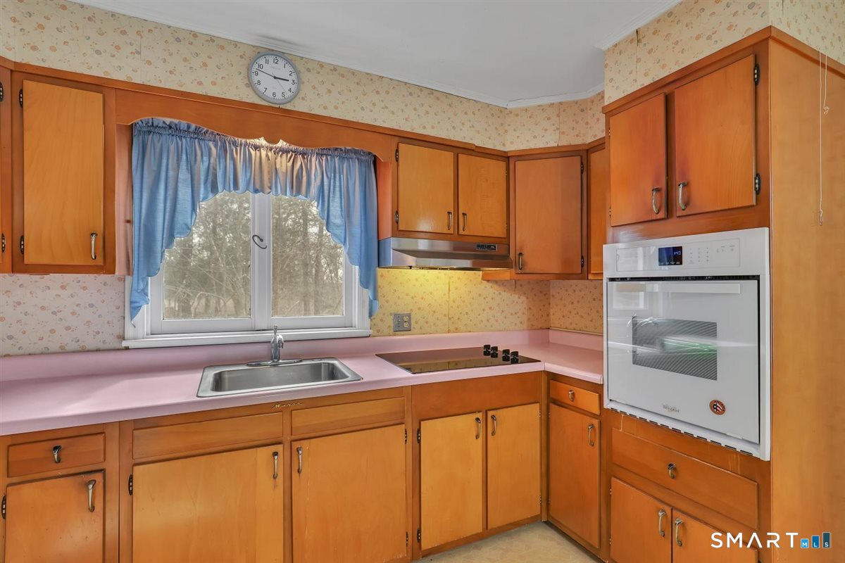 47 Park Road Colchester, CT 06415 - Photo 8 of 31 Cabinetry for days! This U-shaped kitchen features an incredible amount of upper and lower storage ensuring a place for everything.
