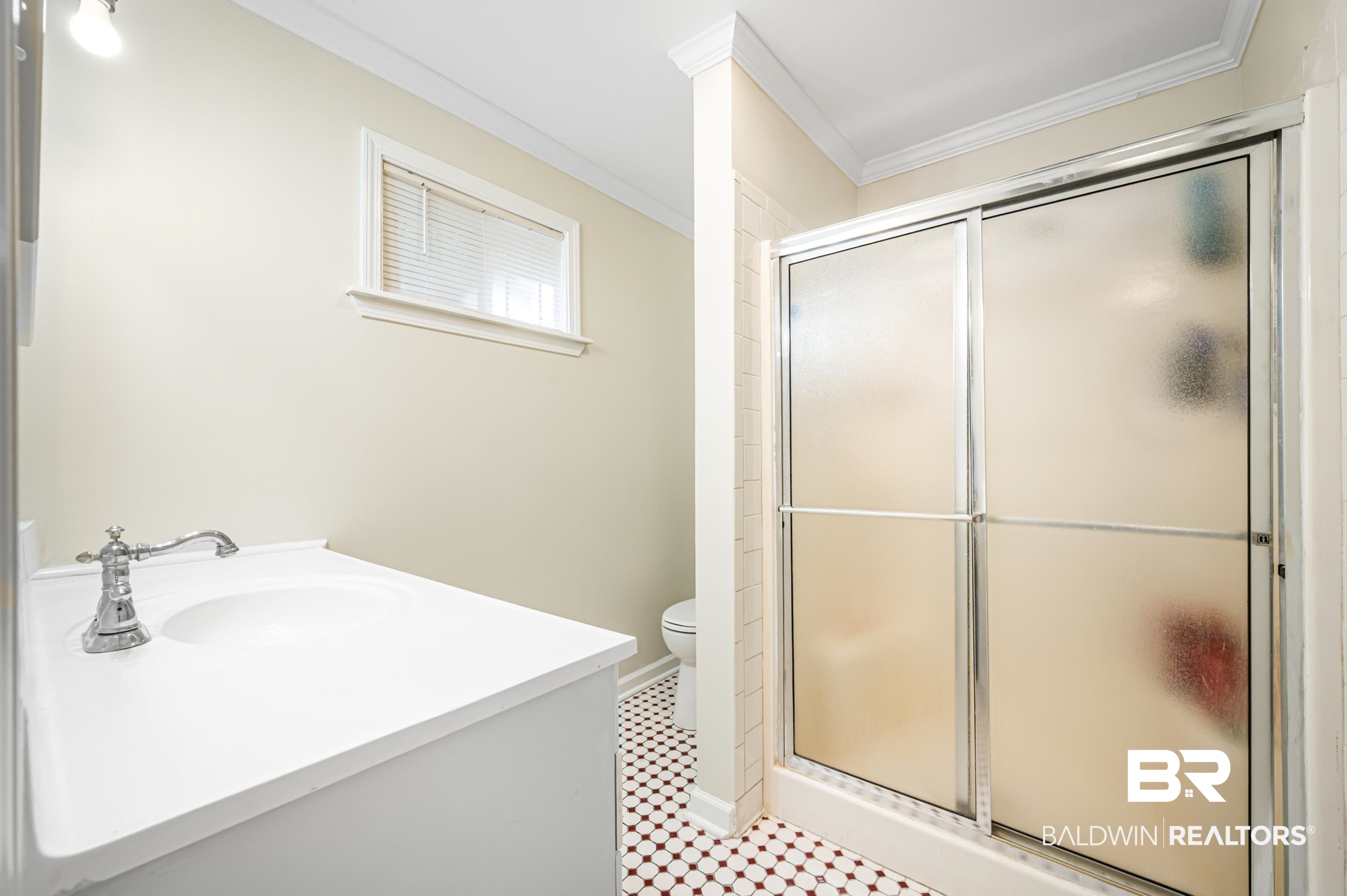 1605 Collier Avenue Bay Minette, AL 36507 - Photo 25 of 36 Full bath featuring vanity, a stall shower, and ornamental molding
