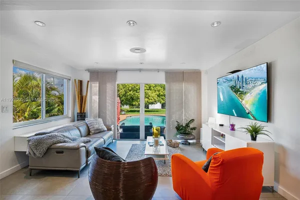 a living room with furniture and a flat screen tv