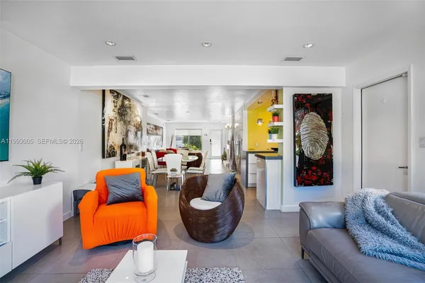a bedroom with a bed and chandelier