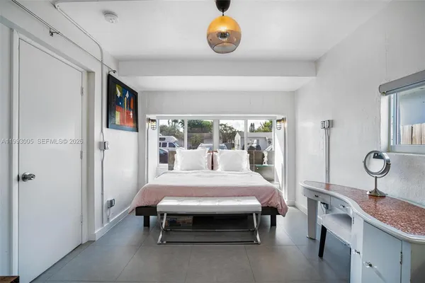 a bedroom with a bed and a table