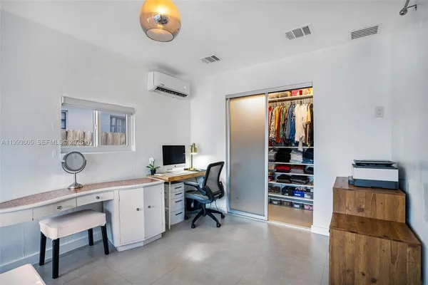 a bedroom with a bed and furniture