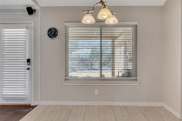 a view of a room that has a window and a window