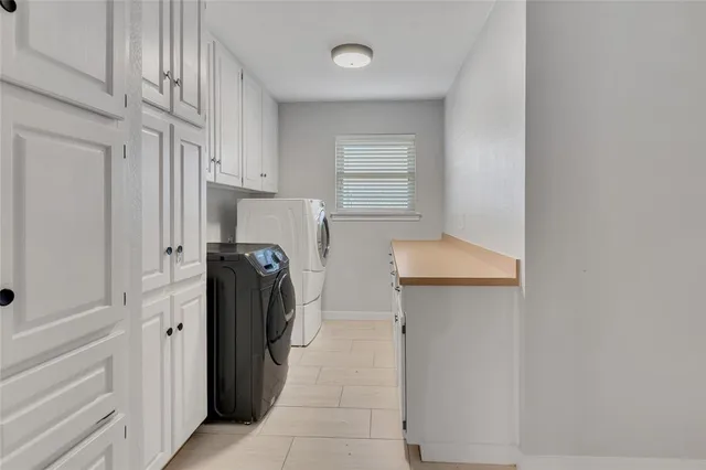 a kitchen with a refrigerator and a sink