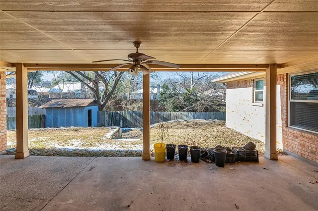 a bed sitting in a room next to a window