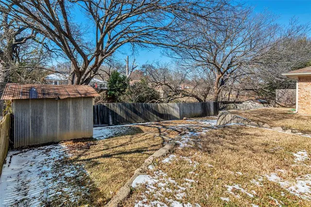 a view of a backyard of the house
