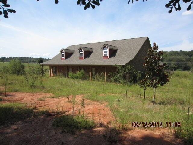 499 Ridgeway Road, Unit 239 Jackson, GA 30233 - Photo 1 of 1 a view of a house with a yard