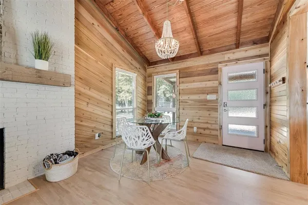 a view of a chairs and table in patio