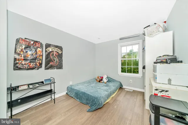 a bedroom with a bed and cabinets