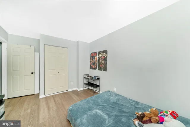 a bathroom with a sink a toilet a mirror and shower curtain