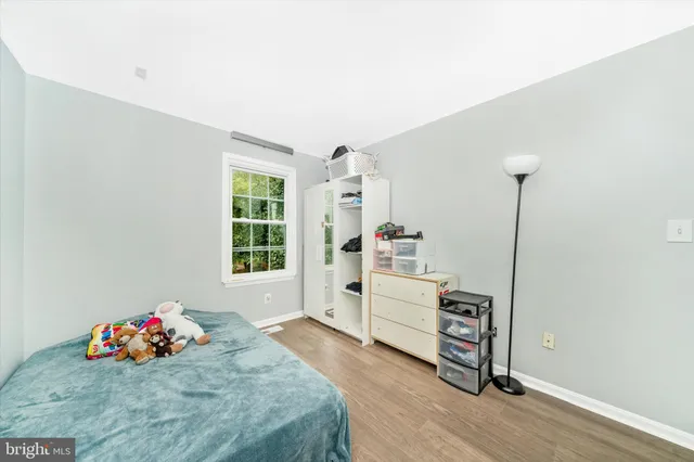 a bed room with a bed and a tv on the dresser
