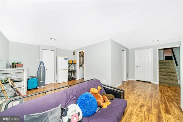 a bed room with a bed and a view of the back