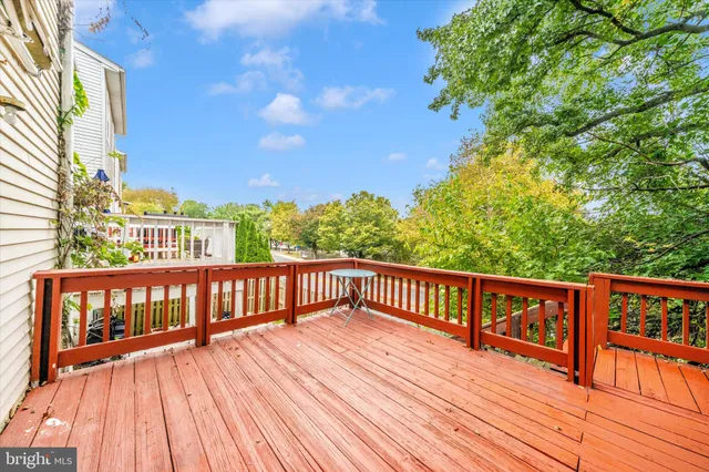 a view of a house with wooden deck