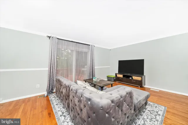 a room with a bed and a flat screen tv