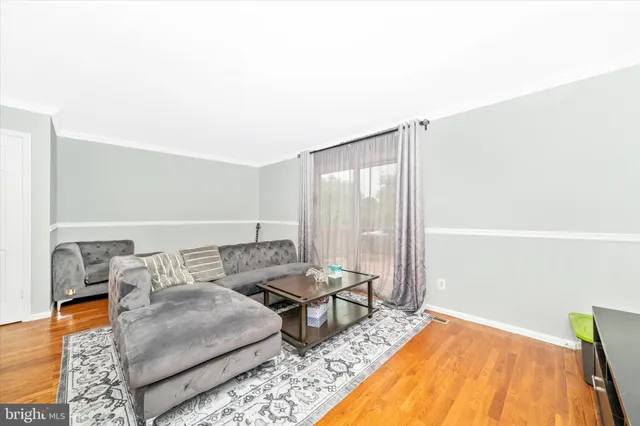 a living room with furniture and a rug