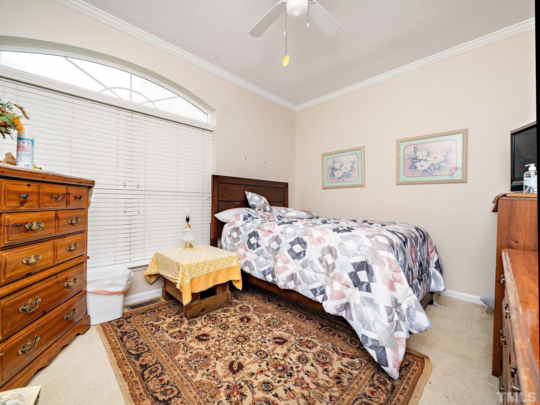 5169 Crabtree Road Nashville, NC 27856 - Photo 12 of 18 a bedroom with a bed and a dresser