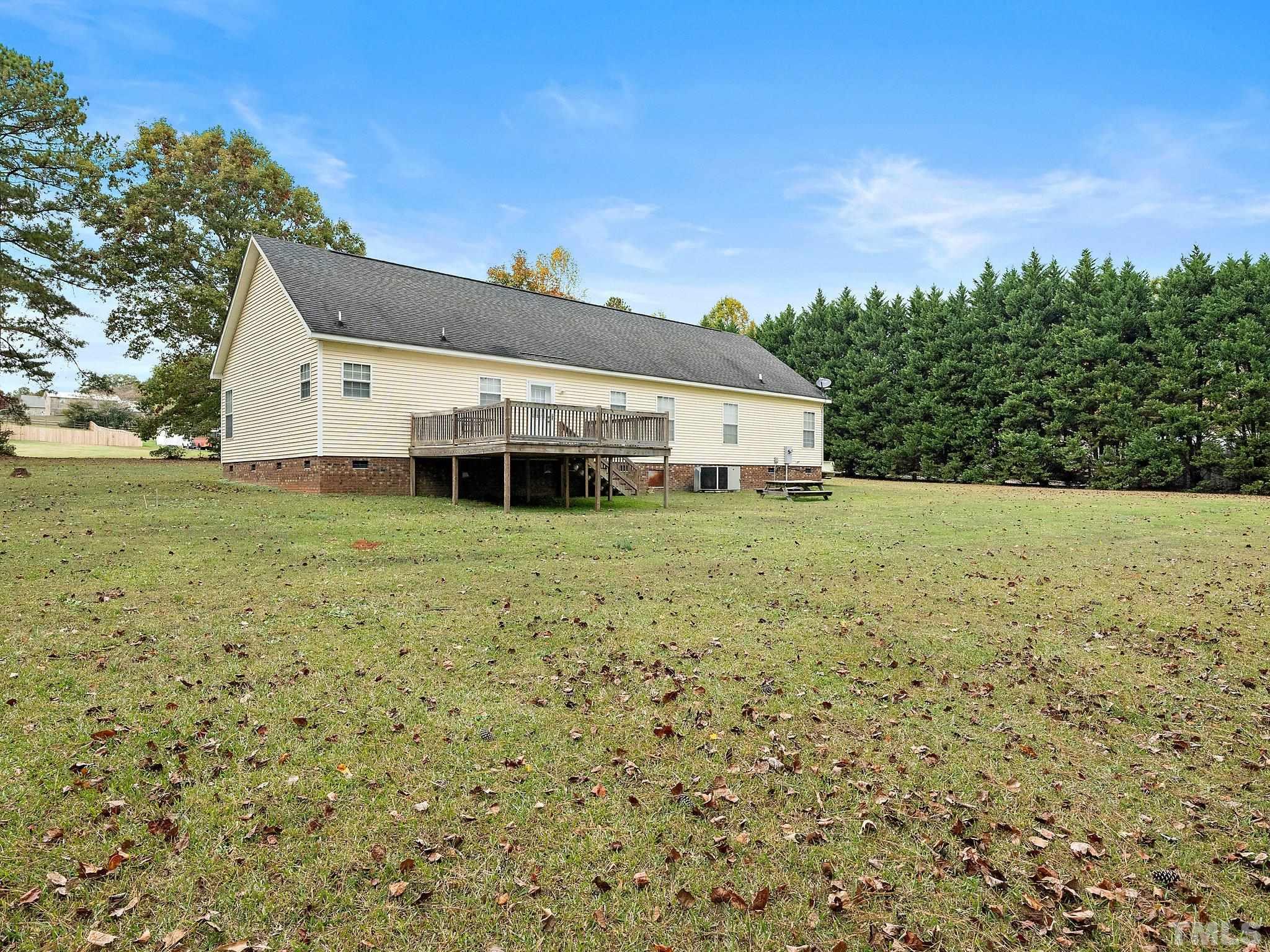 5169 Crabtree Road Nashville, NC 27856 - Photo 17 of 18 a view of a house with a yard