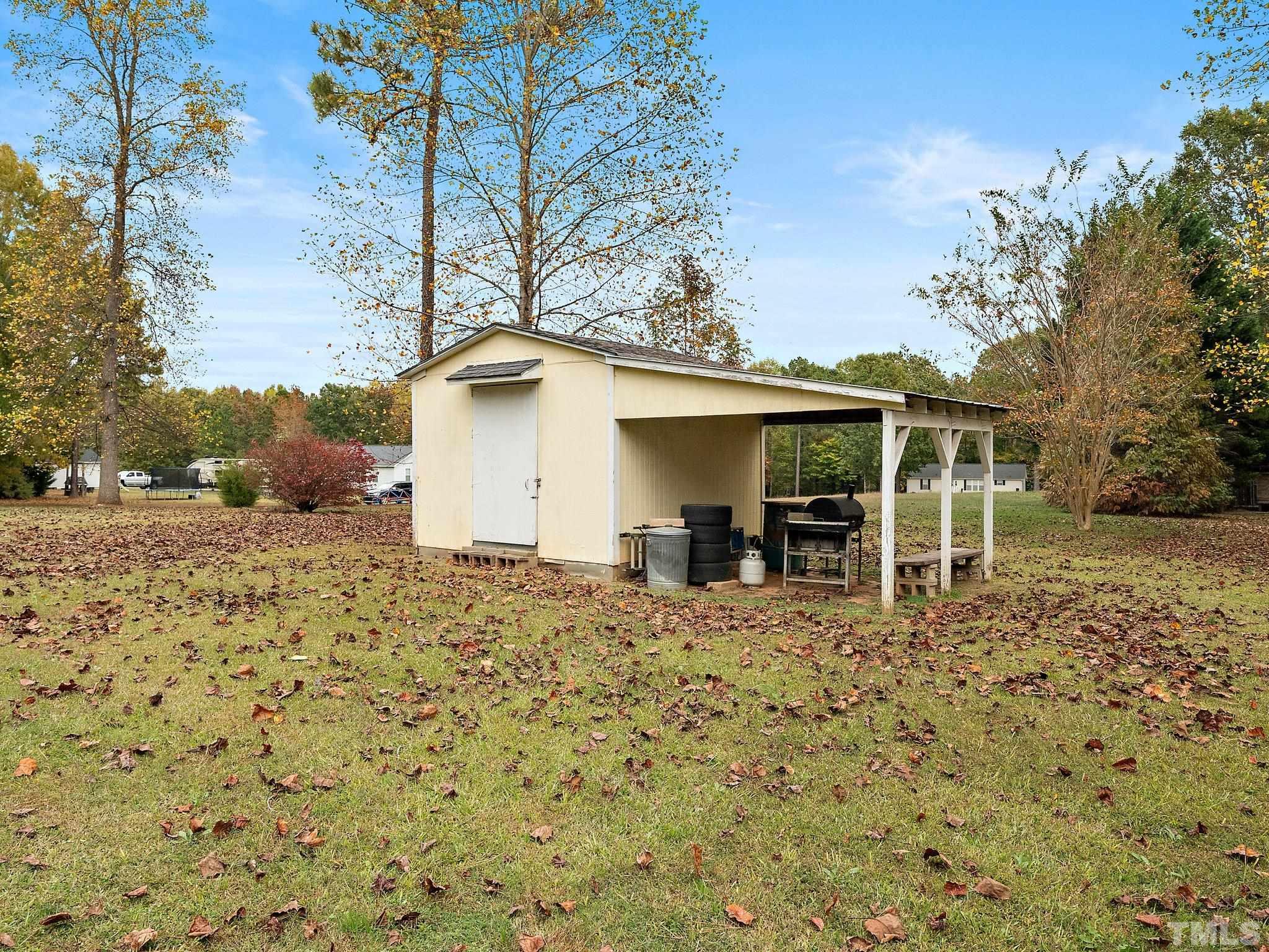 5169 Crabtree Road Nashville, NC 27856 - Photo 18 of 18 a front view of a house with a yard