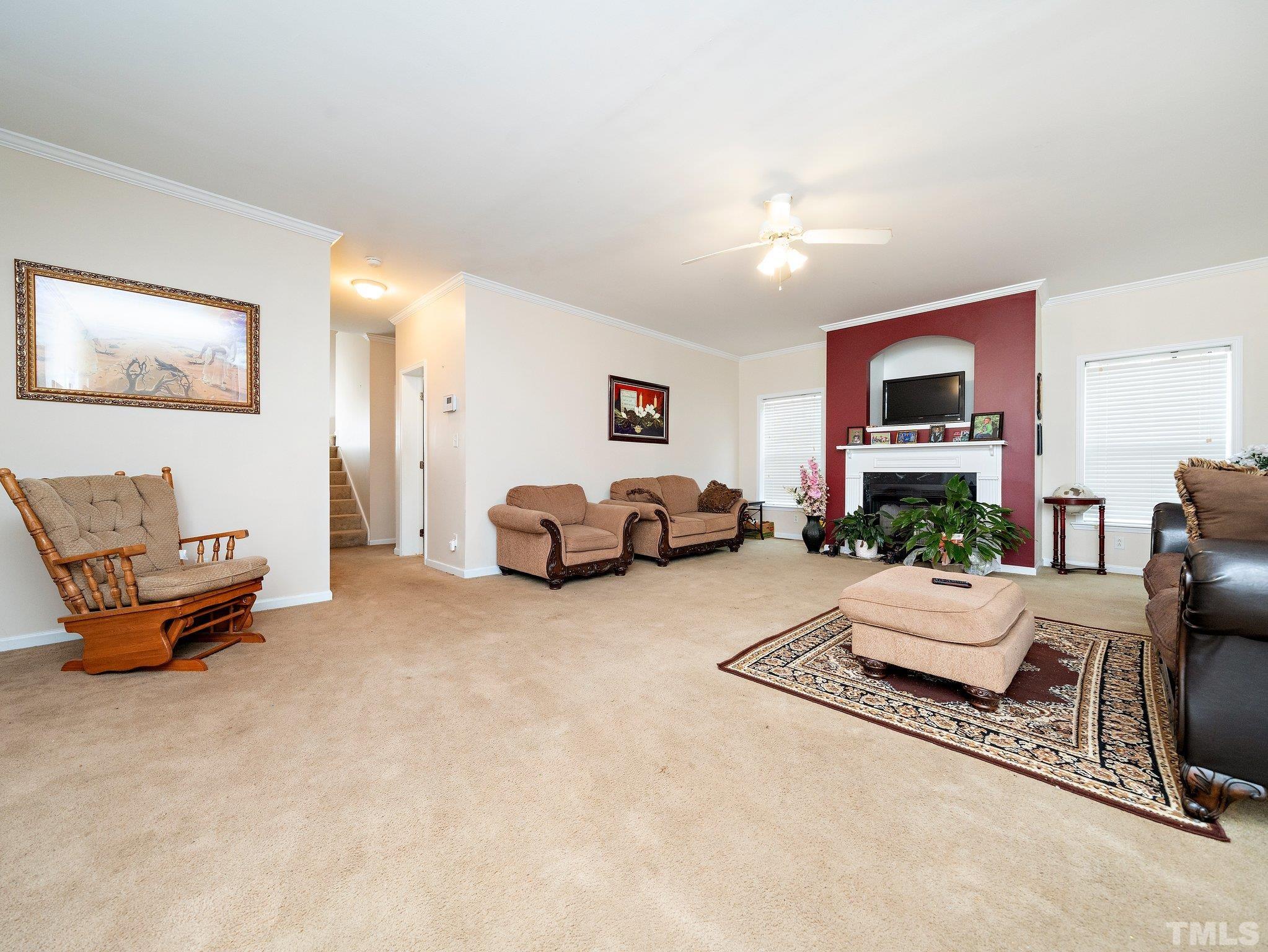 5169 Crabtree Road Nashville, NC 27856 - Photo 3 of 18 a living room with furniture and a lamp