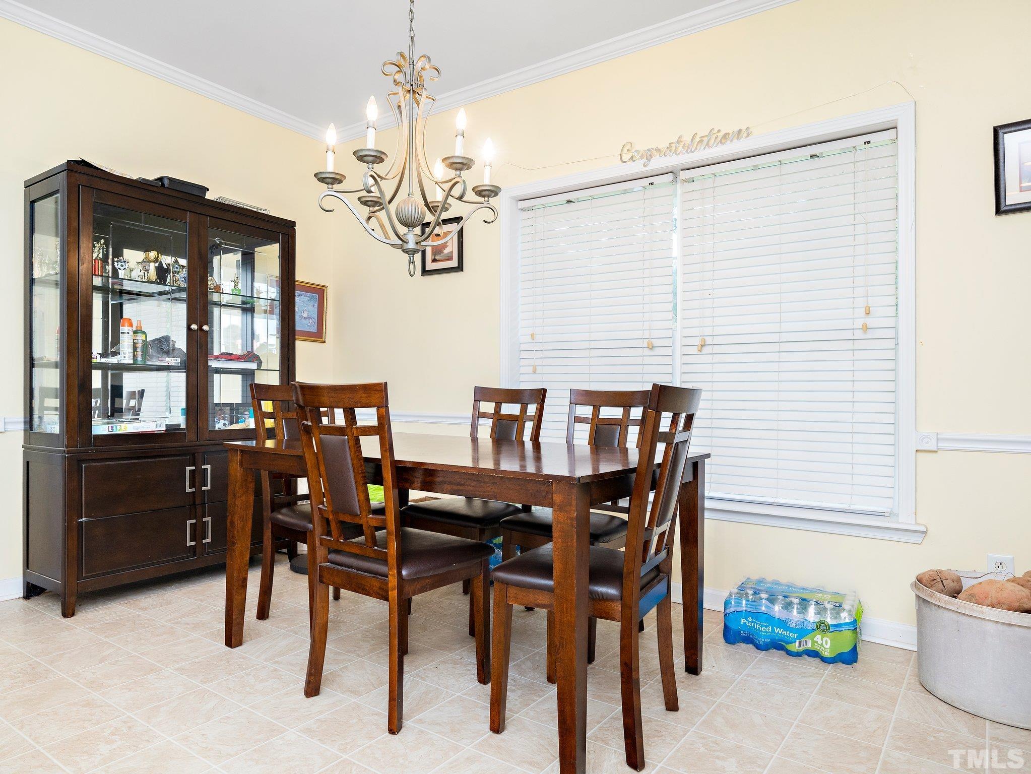 5169 Crabtree Road Nashville, NC 27856 - Photo 5 of 18 a view of a dining room with furniture and chandelier