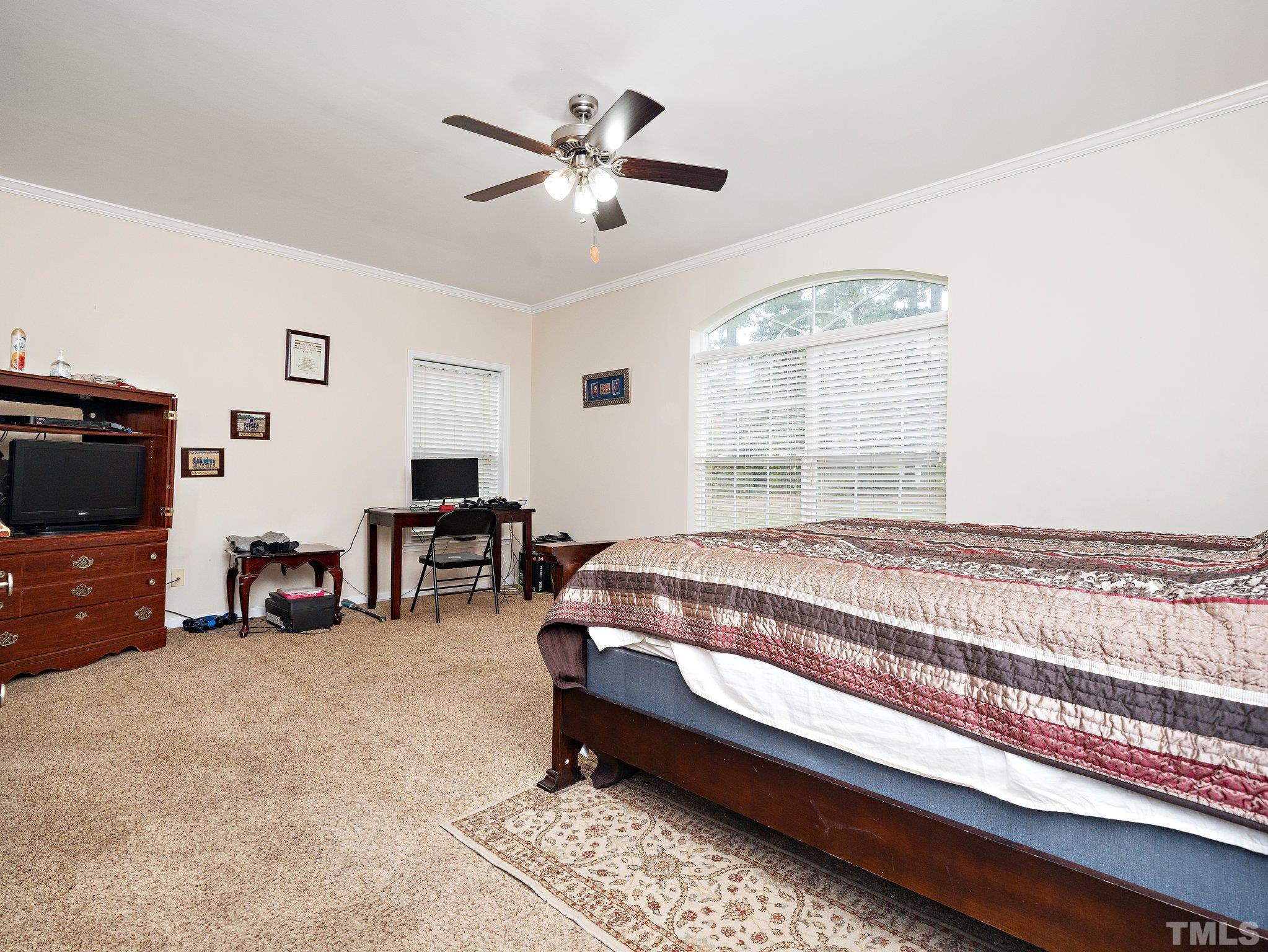 5169 Crabtree Road Nashville, NC 27856 - Photo 8 of 18 a bedroom with furniture and a large window