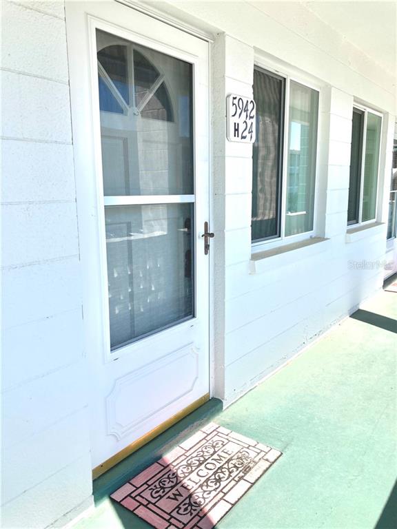 5942 Welcome Road, Unit H24 Bradenton, FL 34207 - Photo 1 of 1 a view of front door of a house