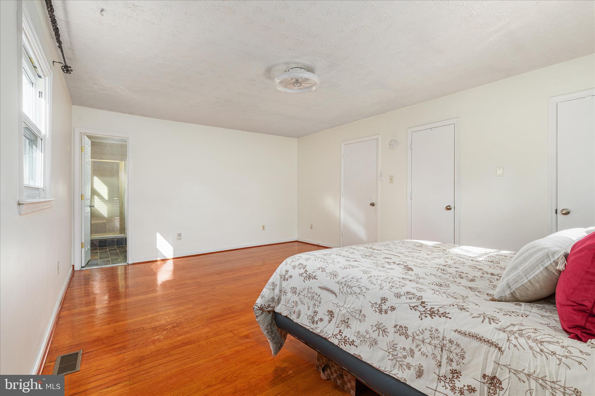 113 Williamson Road Winchester, VA 22602 - Photo 12 of 52 a bedroom with a bed and wooden floor