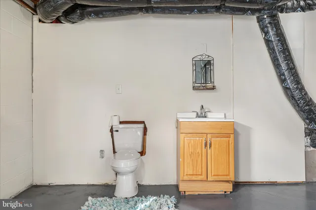 a bathroom with a sink and mirror