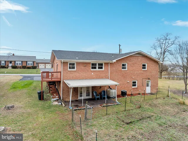 a view of a house with a yard porch and sitting area