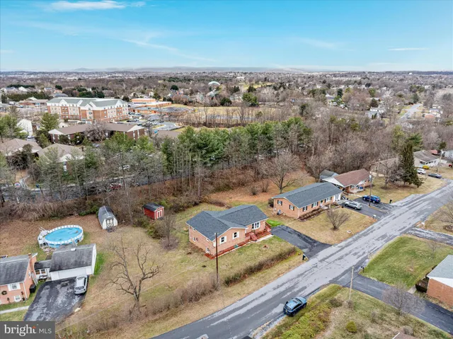 an aerial view of a house with outdoor space