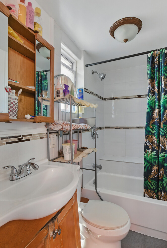 2517 Boston Road Bronx, NY 10467 - Photo 11 of 11 a bathroom with a sink a toilet and shower