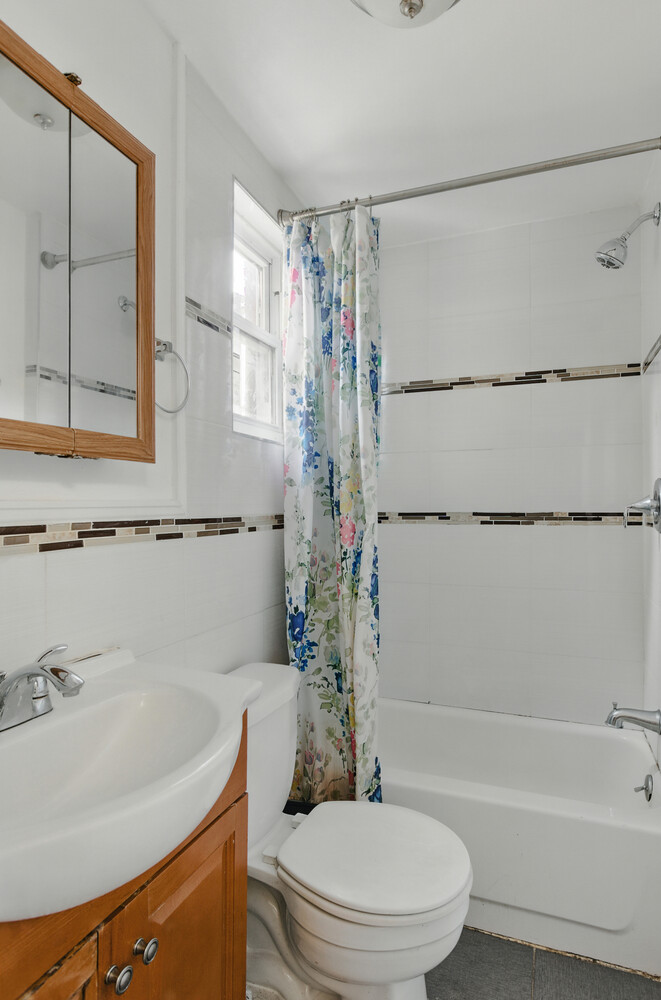 2517 Boston Road Bronx, NY 10467 - Photo 6 of 11 a bathroom with a sink a toilet and a bathtub