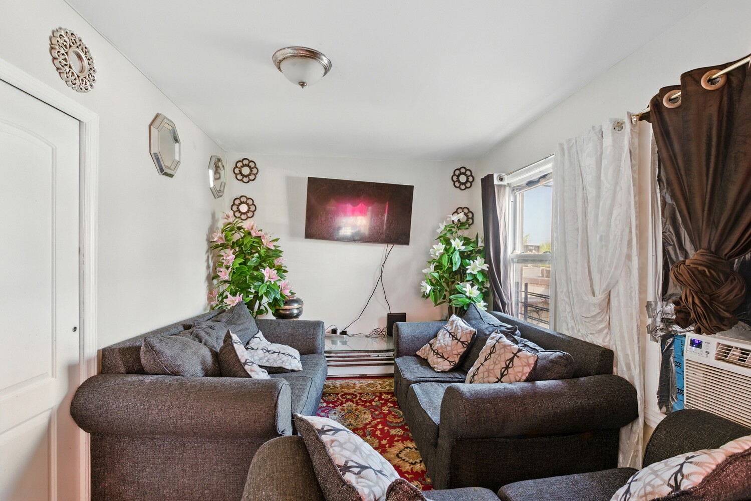 2517 Boston Road Bronx, NY 10467 - Photo 7 of 11 a living room with furniture and a flat screen tv