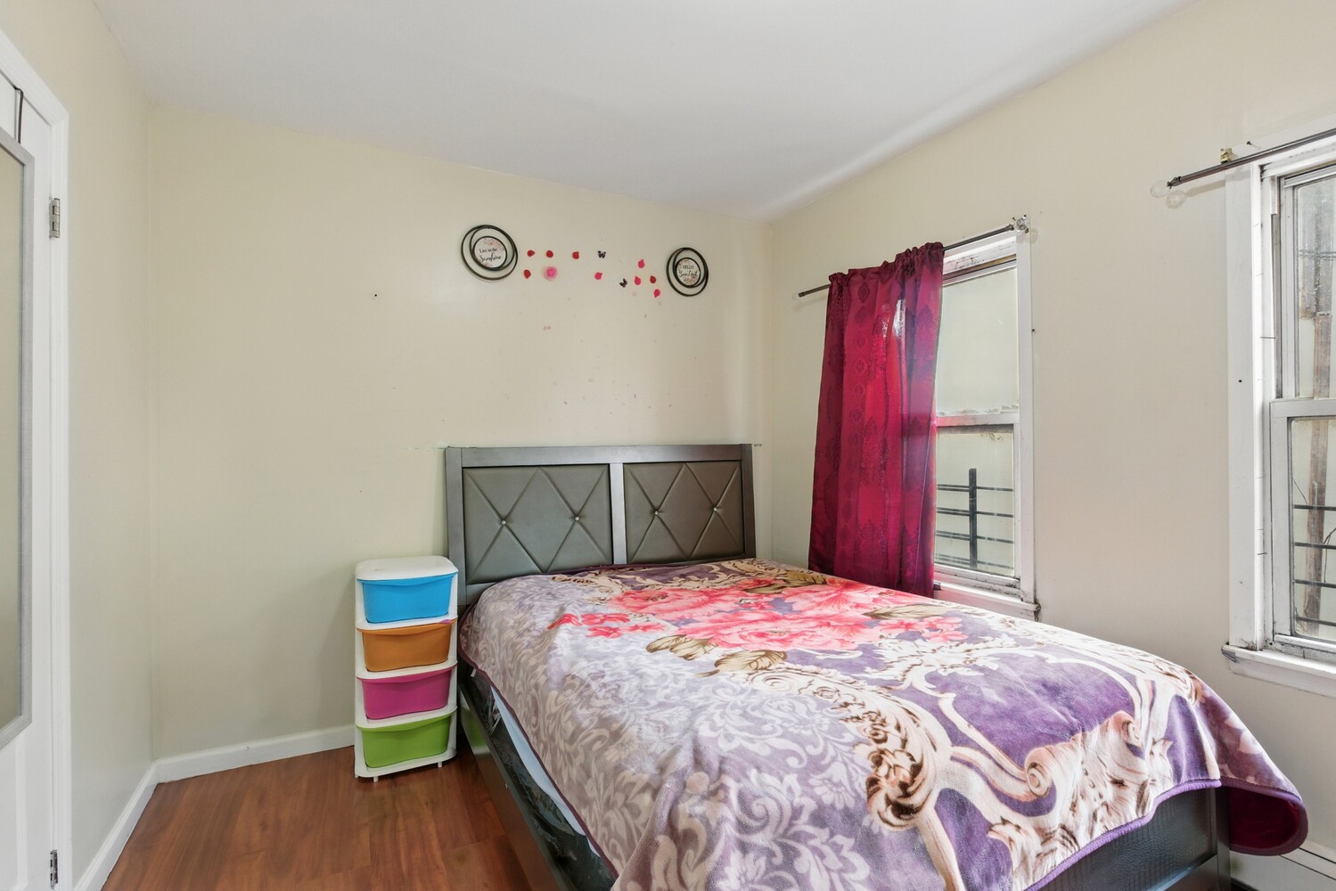 2517 Boston Road Bronx, NY 10467 - Photo 8 of 11 a bedroom with a bed and a wooden floor