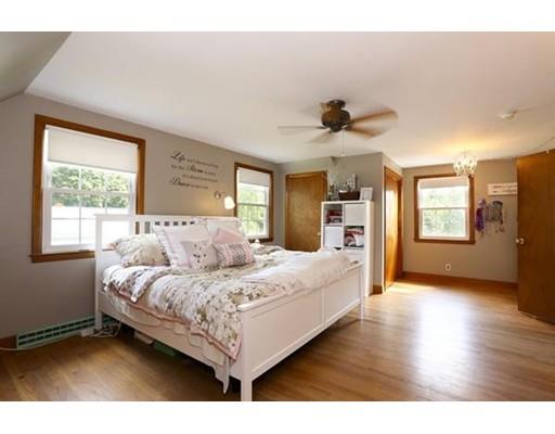 349 Brook Street Dighton, MA 02715 - Photo 14 of 25 a bedroom with a large bed and a chandelier