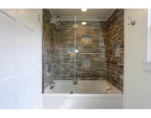 349 Brook Street Dighton, MA 02715 - Photo 16 of 25 a bathroom with a shower and a bath tub