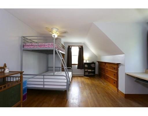 349 Brook Street Dighton, MA 02715 - Photo 20 of 25 a bedroom with a bed and a chandelier