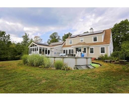 349 Brook Street Dighton, MA 02715 - Photo 23 of 25 a front view of a house with a garden and lake view