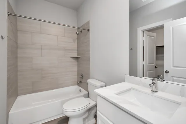 a bathroom with a sink a toilet and a bathtub