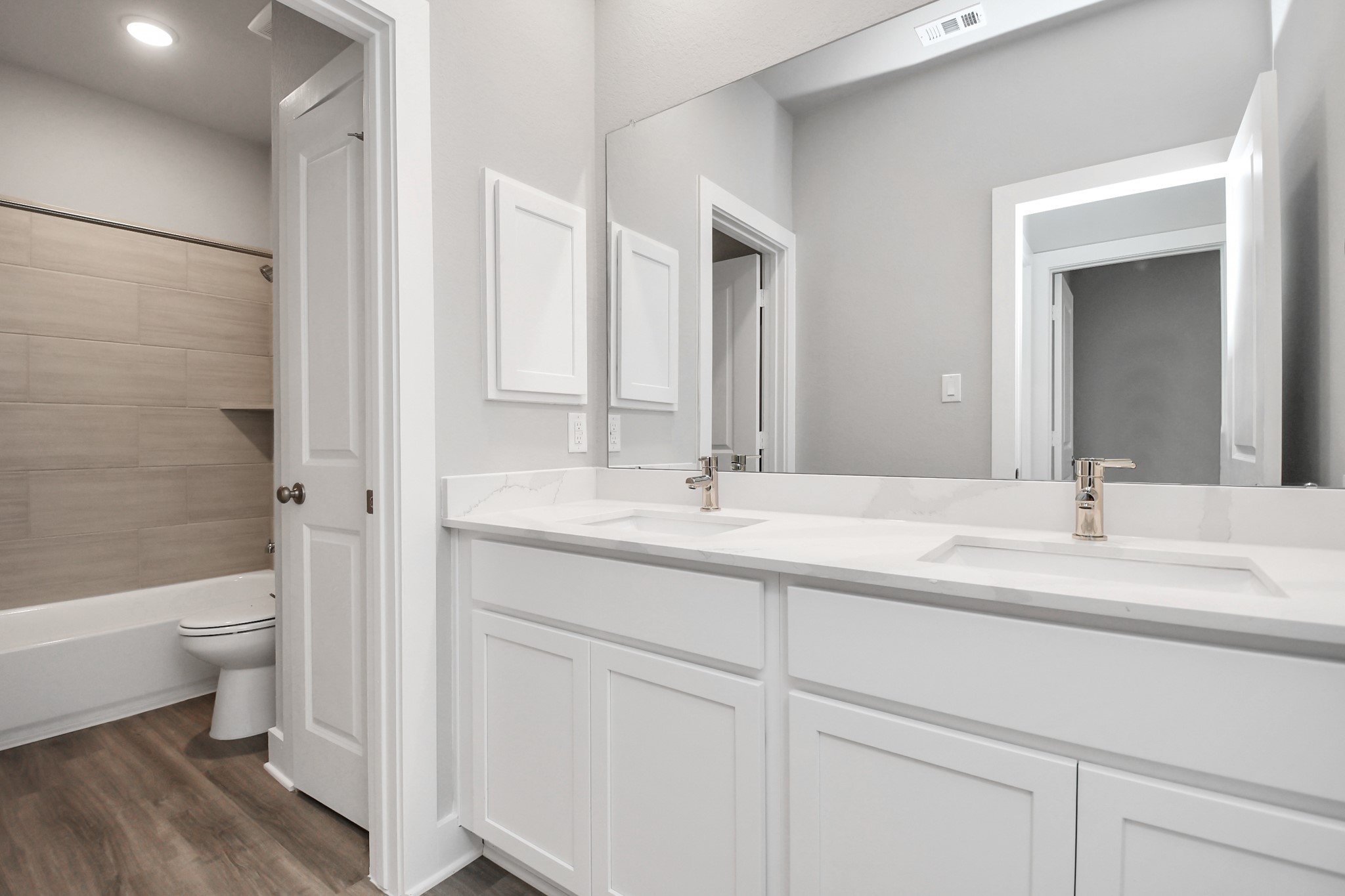 7514 Terramar Bay Lane Cypress, TX 77433 - Photo 16 of 23 a bathroom with a double vanity sink toilet and shower