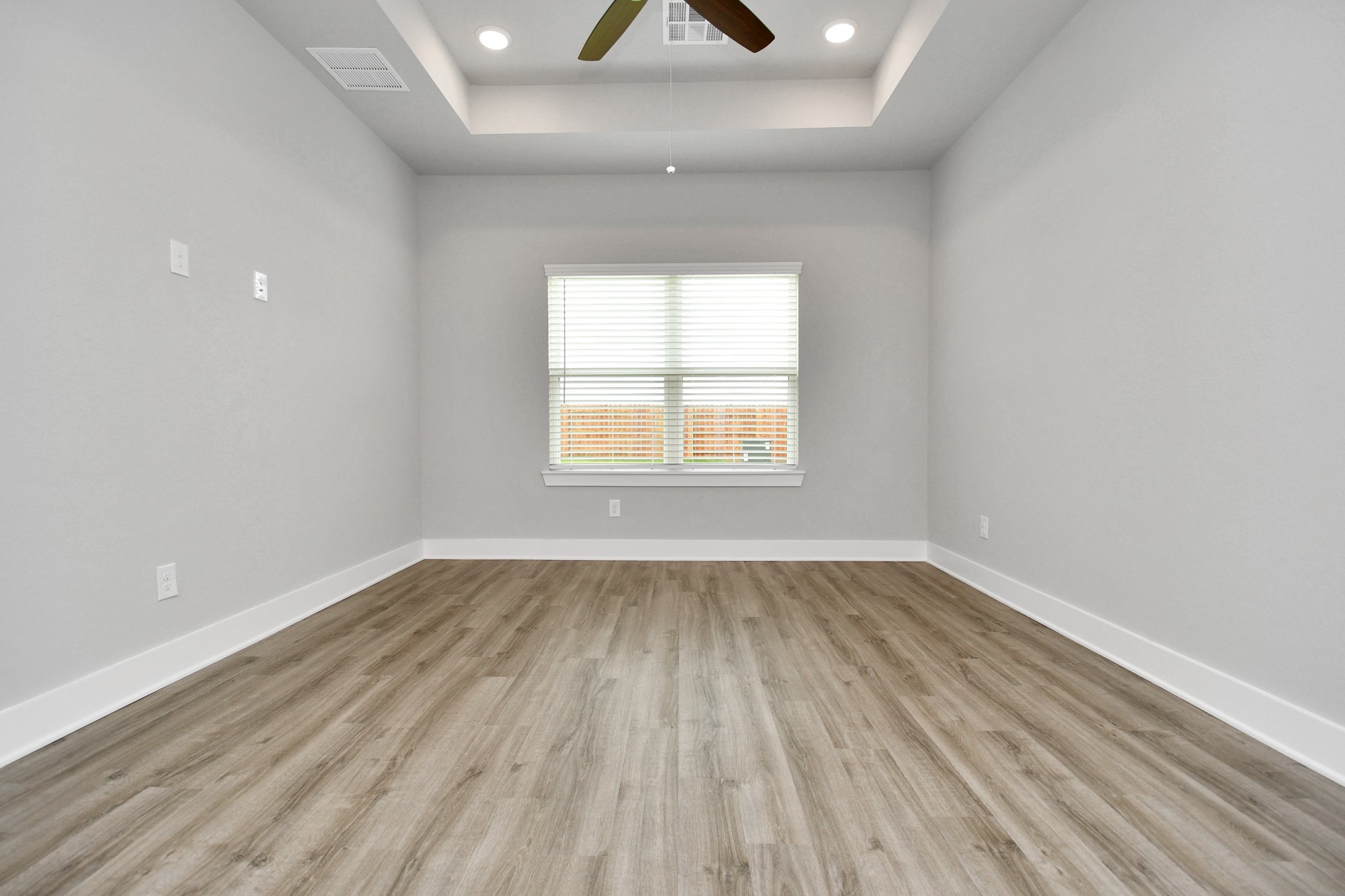 7514 Terramar Bay Lane Cypress, TX 77433 - Photo 9 of 23 wooden floor in an empty room with a window