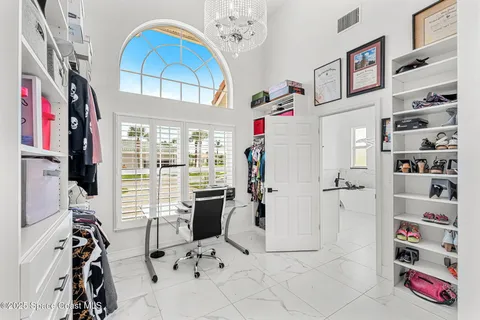 a view of living room with furniture and window