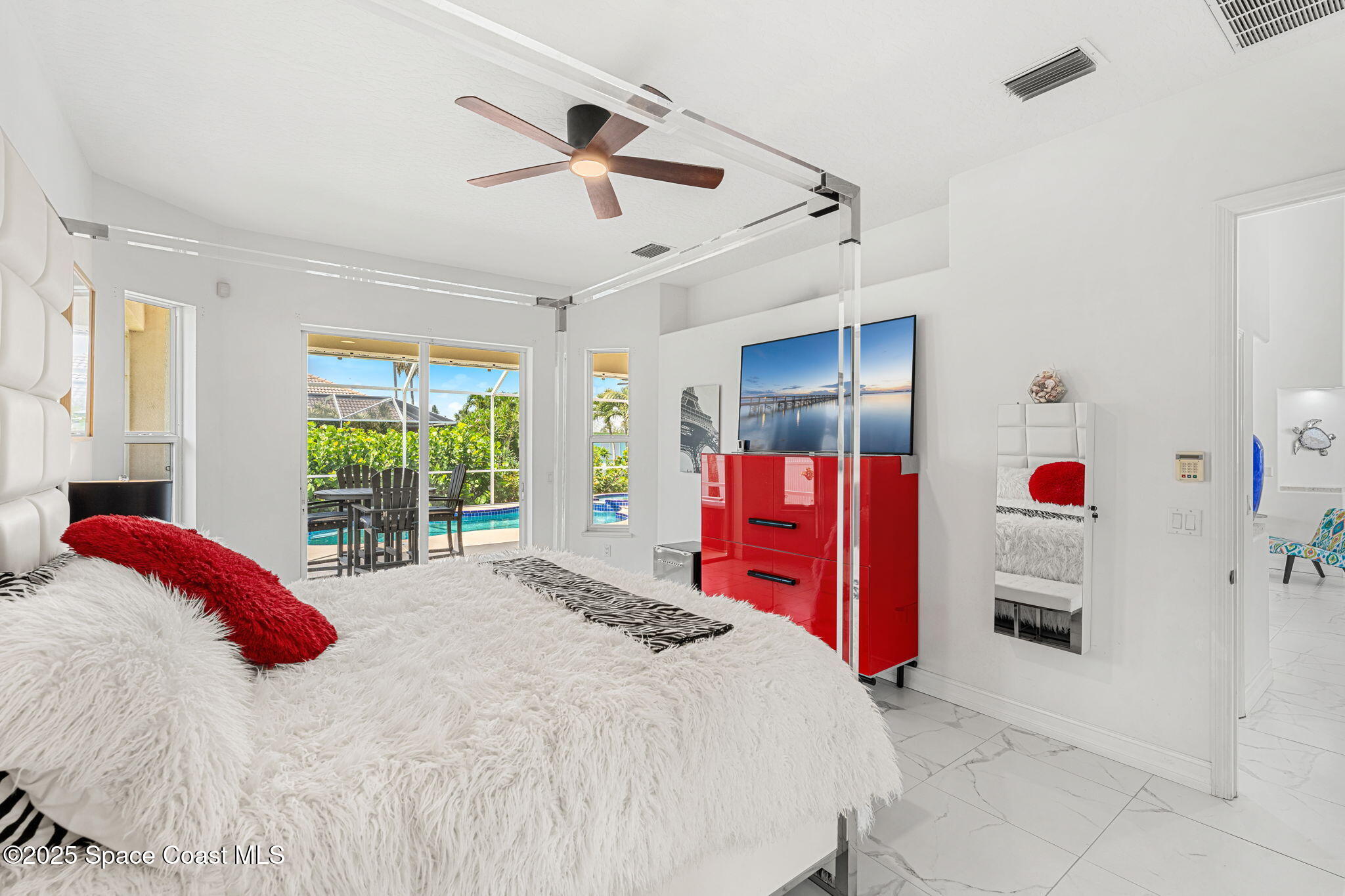 227 Loggerhead Drive Melbourne Beach, FL 32951 - Photo 17 of 52 a bed room with a bed and a window