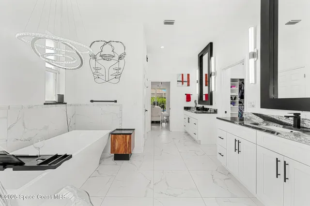 a spacious bathroom with a double vanity sink and a mirror