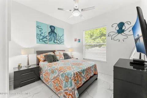 a bedroom with bed and a window