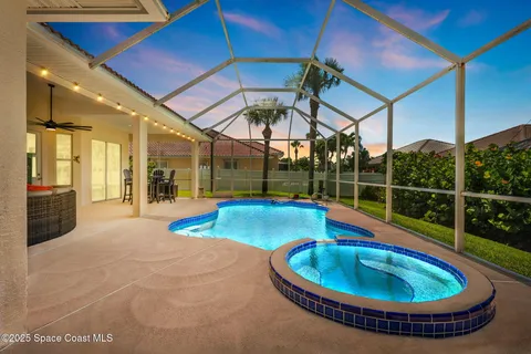 a view of a backyard with table and chairs