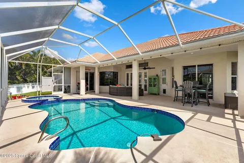 a view of a patio with swimming pool table and chairs