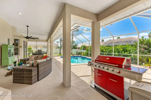 a room with furniture and a floor to ceiling window